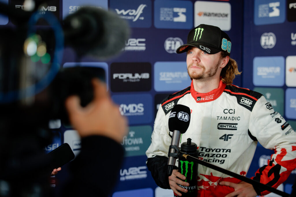 WRC rally driver Kalle Rovanperä in Toyota Gazoo Racing suit during a media interview.