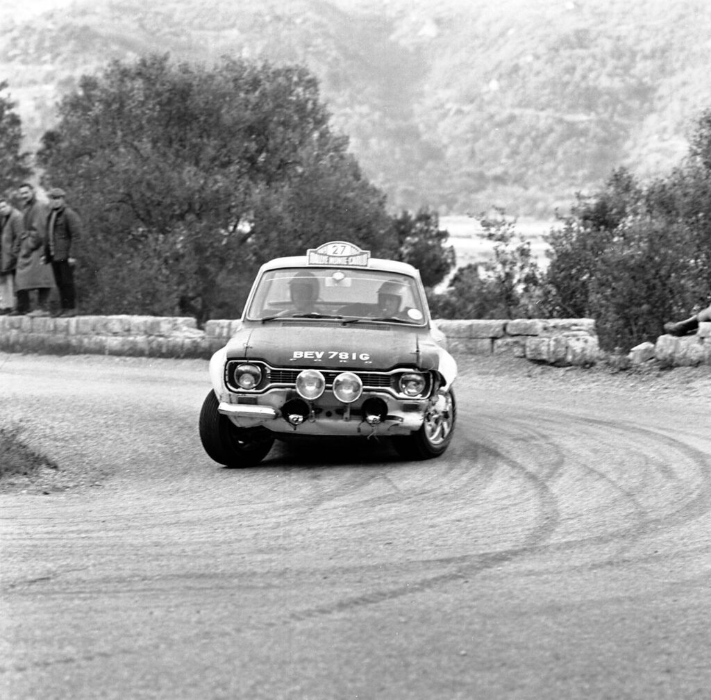Vintage Ford Escort Mk1 rally car BEV 781G cornering at the Monte Carlo Rally.